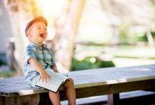 A photo showing a laughing boy filled with happiness