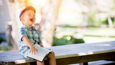 Is Happiness Affected by Aging? When Are We the Happiest in Life? 4 A photo showing a laughing boy filled with happiness
