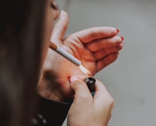 The Untold Truth about Smoking 1 A woman smoking a cigarette