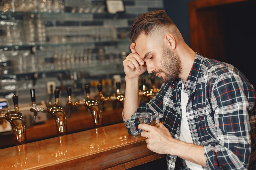 sad man with alcohol glass 