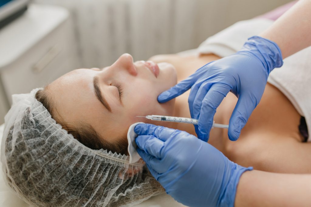 a woman receiving Botox as an anti-aging treatment