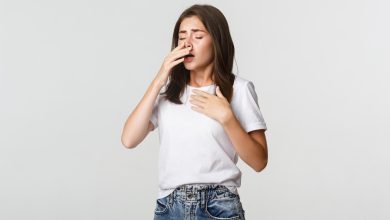 young woman with allergy sneezing girl feeling sick having runny nose 1