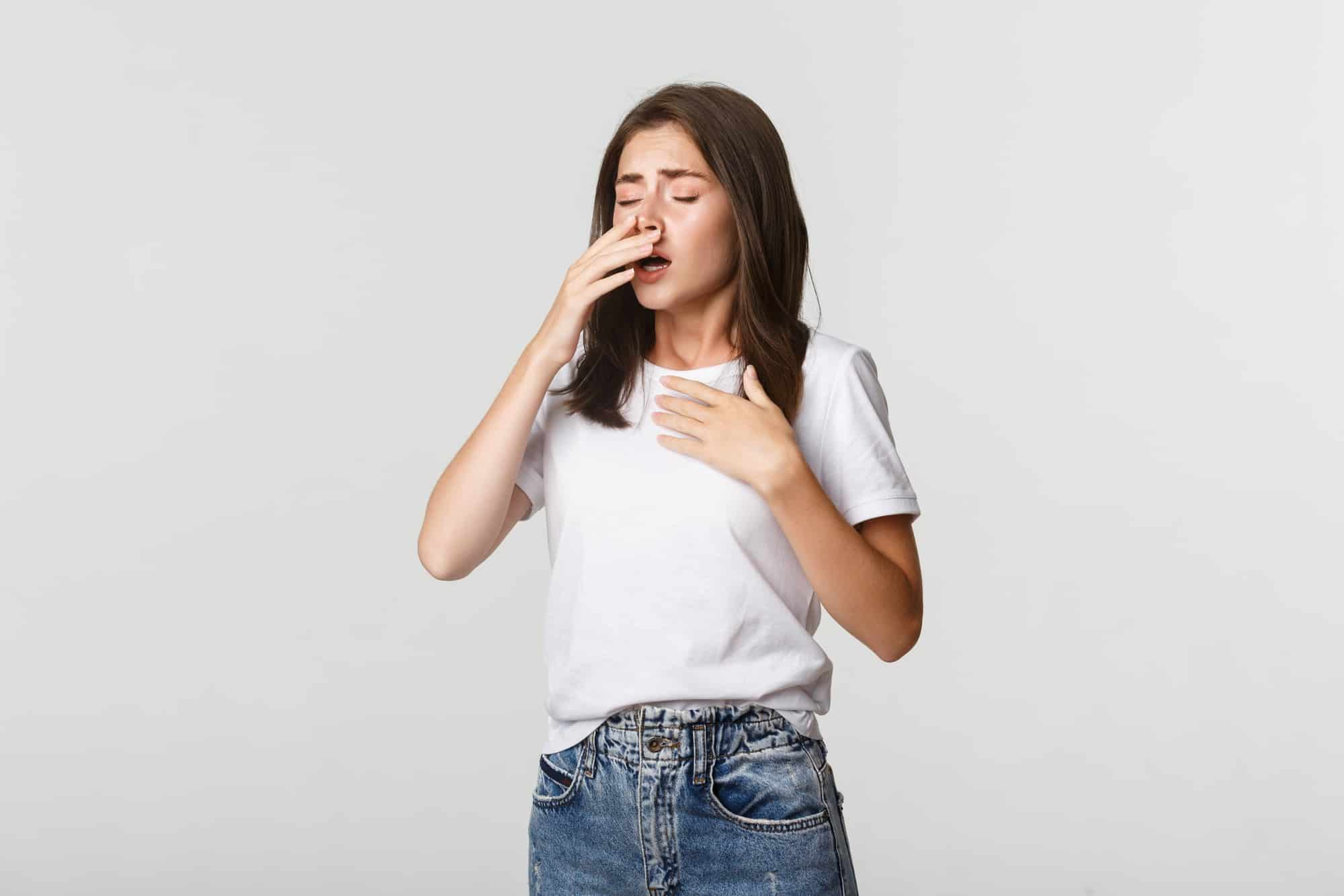The Cold and Flu: Understanding the Basic Respiratory Conditions 1 young woman with allergy sneezing girl feeling sick having runny nose 1