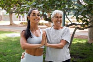 Revitalizing Your Golden Years- The Best Exercises for People Over 50 5 friends doing yoga together park