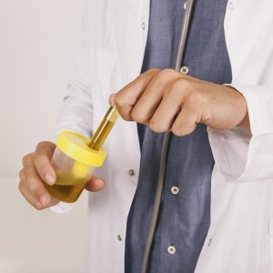 doctor s hands holding urine test