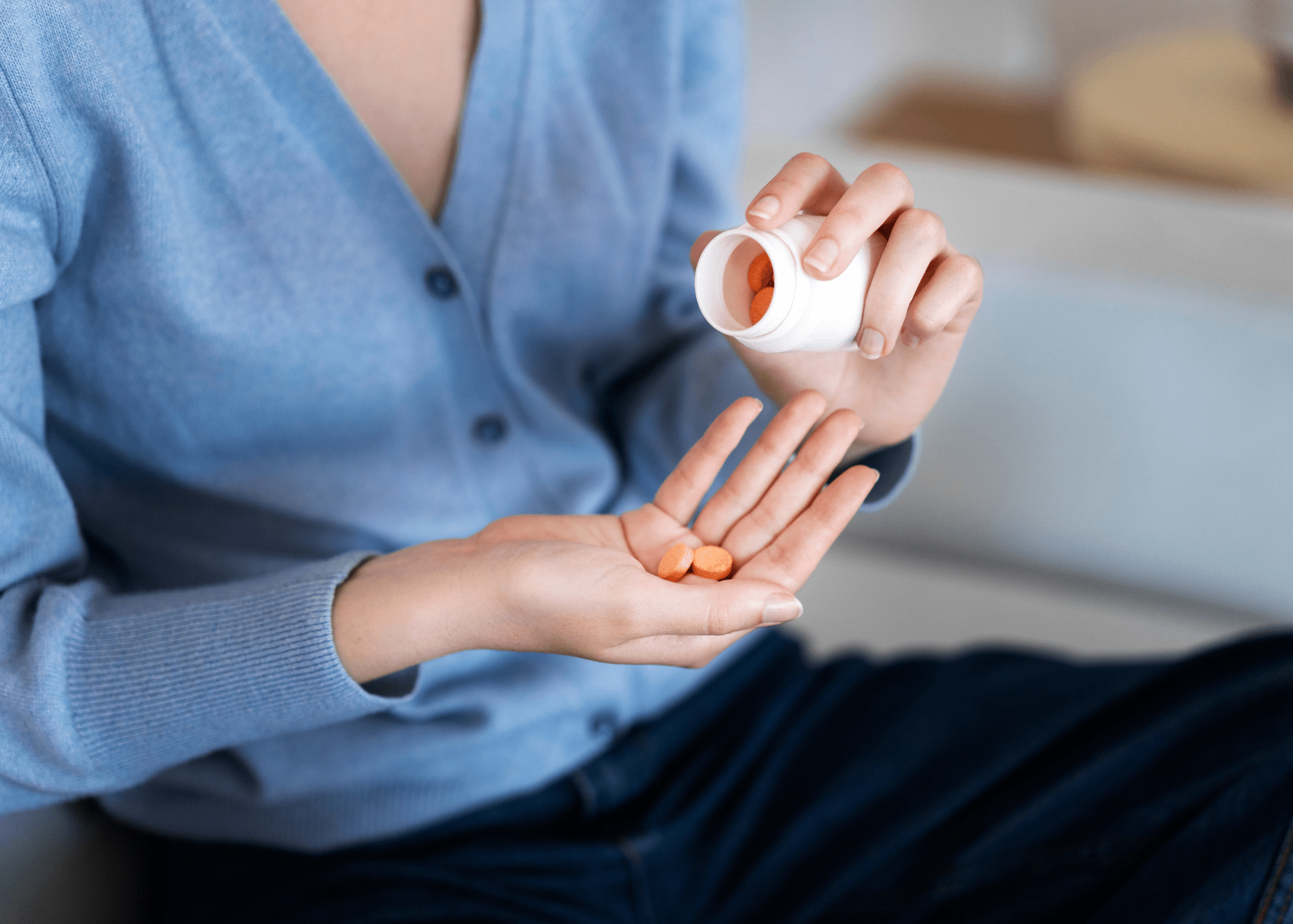 A Complete Guide to Longevity Supplements. When Shall We Start Taking Them for Better Aging? 1 a woman holding longevity supplements